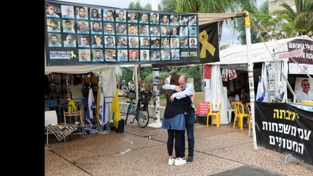 <span class="" word="ガ">ガ</span><span class="" word="ザ">ザ</span><span class="" word="に">に</span><span class="" word="い">い</span><span class="" word="る">る</span><ruby ><rb><span class="jlpt-n1" word="人質">人質</span></rb><rt>ひとじち</rt></ruby><span class="" word="に">に</span><span class="" word="つ">つ</span><span class="" word="い">い</span><span class="" word="て">て</span>