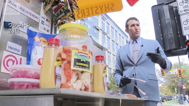 <span class="jlpt-n4" word="アメリカ">アメリカ</span><ruby ><rb><span class="jlpt-n3" word="政府">政府</span></rb><rt>せいふ</rt></ruby><span class="" word="の">の</span><span class="" word="一">一</span><ruby ><rb><span class="" word="部">部</span></rb><rt>ぶ</rt></ruby><span class="" word="が">が</span><ruby ><rb><span class="" word="閉">閉</span></rb><rt>し</rt></ruby><span class="" word="ま">ま</span><span class="" word="っ">っ</span><span class="" word="て">て</span><span class="" word="い">い</span><span class="" word="る">る</span><span class="" word="こ">こ</span><span class="" word="と">と</span><span class="" word="で">で</span><span class="" word="、">、</span><span class="" word="フ">フ</span><span class="" word="ー">ー</span><span class="" word="ド">ド</span><span class="" word="バ">バ</span><span class="" word="ン">ン</span><span class="" word="ク">ク</span><span class="" word="を">を</span><ruby ><rb><span class="" word="使">使</span></rb><rt>つか</rt></ruby><span class="" word="う">う</span><ruby ><rb><span class="jlpt-n5" word="人">人</span></rb><rt>ひと</rt></ruby><span class="" word="が">が</span><ruby ><rb><span class="" word="増">増</span></rb><rt>ふ</rt></ruby><span class="" word="え">え</span><span class="" word="て">て</span><span class="" word="い">い</span><span class="" word="ま">ま</span><span class="" word="す">す</span>