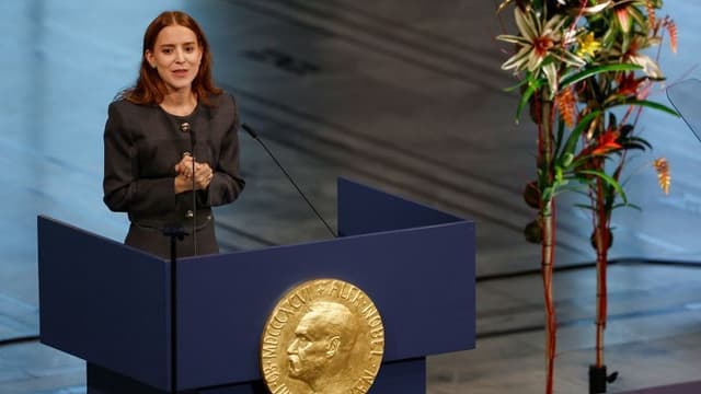 <span class="" word="ノ">ノ</span><span class="" word="ー">ー</span><span class="" word="ベ">ベ</span><span class="" word="ル">ル</span><ruby ><rb><span class="jlpt-n3" word="平和">平和</span><span class="jlpt-n3" word="賞">賞</span></rb><rt>へいわしょう</rt></ruby><span class="" word="、">、</span><span class="" word="マ">マ</span><span class="" word="チ">チ</span><span class="" word="ャ">ャ</span><span class="" word="ド">ド</span><span class="jlpt-n1" word="さん">さん</span><span class="" word="の">の</span><ruby ><rb><span class="jlpt-n4" word="娘">娘</span></rb><rt>むすめ</rt></ruby><span class="" word="が">が</span><ruby ><rb><span class="jlpt-n3" word="代理">代理</span></rb><rt>だいり</rt></ruby><span class="" word="で">で</span><ruby ><rb><span class="unknown" word="受賞">受賞</span></rb><rt>じゅしょう</rt></ruby>