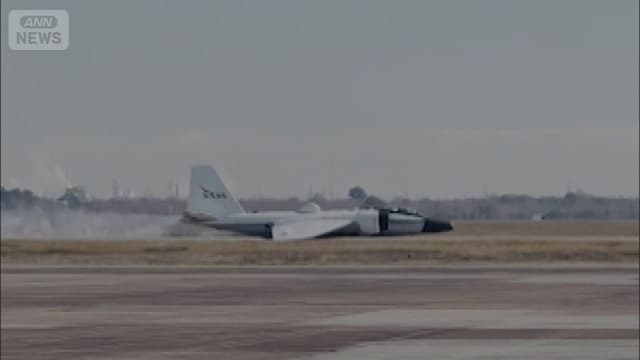 <span class="" word="N">N</span><span class="" word="A">A</span><span class="" word="S">S</span><span class="" word="A">A</span><span class="" word="の">の</span><span class="" word="ひ">ひ</span><span class="" word="こ">こ</span><span class="" word="う">う</span><span class="" word="き">き</span> <ruby><rb><span class="jlpt-n5" word="車">車</span></rb><rt>くるま</rt></ruby><span class="" word="の">の</span><ruby><rb><span class="jlpt-n1" word="タイヤ">タイヤ</span></rb><rt>たいや</rt></ruby><span class="" word="が">が</span><ruby><rb><span class="" word="出">出</span></rb><rt>で</rt></ruby><span class="" word="ず">ず</span><span class="" word="に">に</span><span class="jlpt-n5" word="おなか">おなか</span><span class="" word="で">で</span><ruby><rb><span class="jlpt-n1" word="着陸">着陸</span></rb><rt>ちゃくりく</rt></ruby> <span class="" word="2">2</span><ruby><rb><span class="jlpt-n5" word="人">人</span></rb><rt>にん</rt></ruby><span class="" word="は">は</span><ruby><rb><span class="jlpt-n3" word="無事">無事</span></rb><rt>ぶじ</rt></ruby>