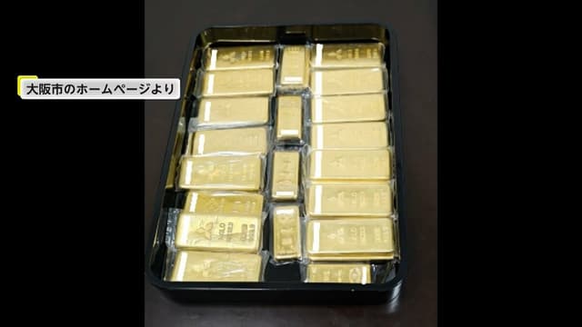 <ruby><rb><span class="unknown" word="大阪">大阪</span></rb><rt>おおさか</rt></ruby><span class="" word="で">で</span><span class="" word="2">2</span><span class="" word="1">1</span><span class="" word="k">k</span><span class="" word="g">g</span><span class="" word="の">の</span><ruby><rb><span class="unknown" word="金塊">金塊</span></rb><rt>きんかい</rt></ruby><span class="" word="が">が</span><ruby><rb><span class="jlpt-n4" word="水道">水道</span></rb><rt>すいどう</rt></ruby><span class="" word="の">の</span><span class="" word="た">た</span><span class="" word="め">め</span><span class="" word="に">に</span><ruby><rb><span class="jlpt-n3" word="寄付">寄付</span></rb><rt>きふ</rt></ruby><span class="" word="さ">さ</span><span class="" word="れ">れ</span><span class="" word="る">る</span>